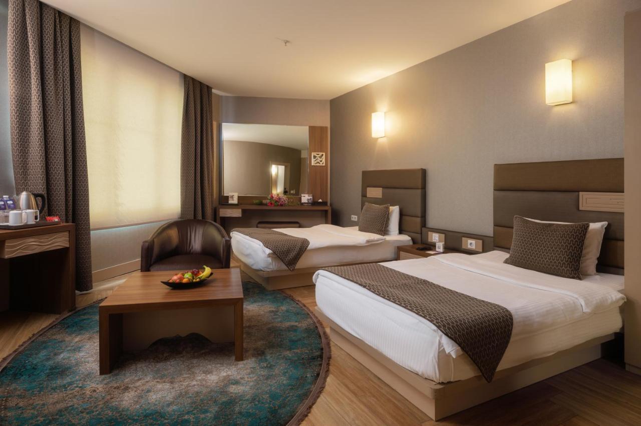 Titanic Hotel & Spa 술라이마니야 외부 사진 A room at the hotel